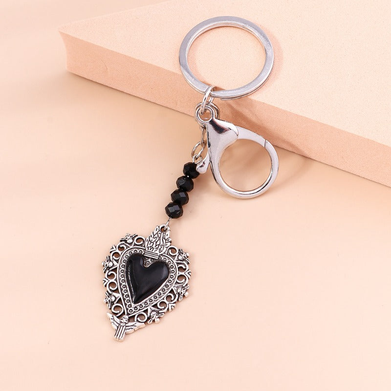 Wholesale Butterfly Cross Hollow Lace Love Devil Eyes Keychain